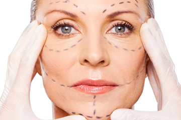 Woman with markings on her face.